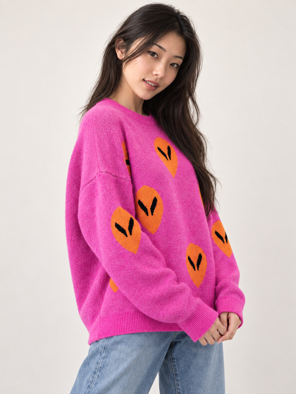 Model wearing Alien Sweater Pink — three-quarter view
