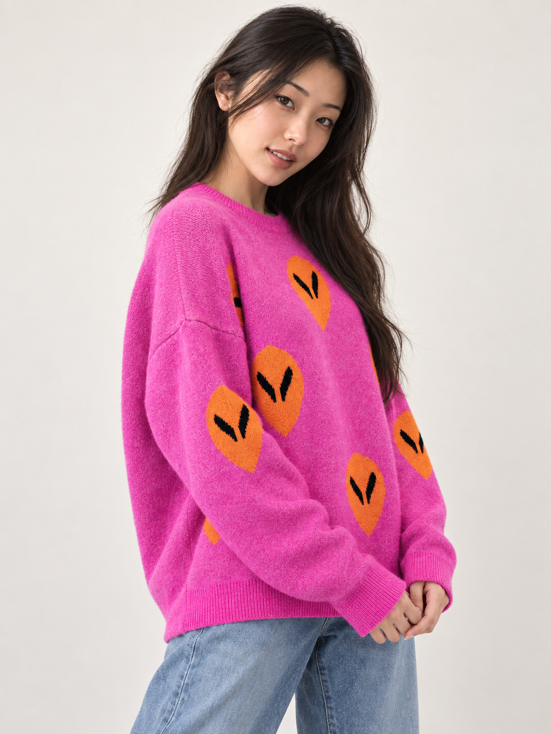 Model wearing Alien Sweater Pink — three-quarter view