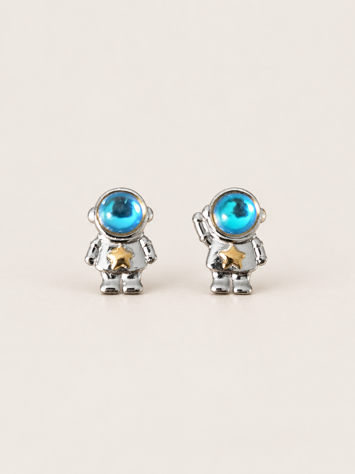 Astronaut Earrings shown on a warm neutral background