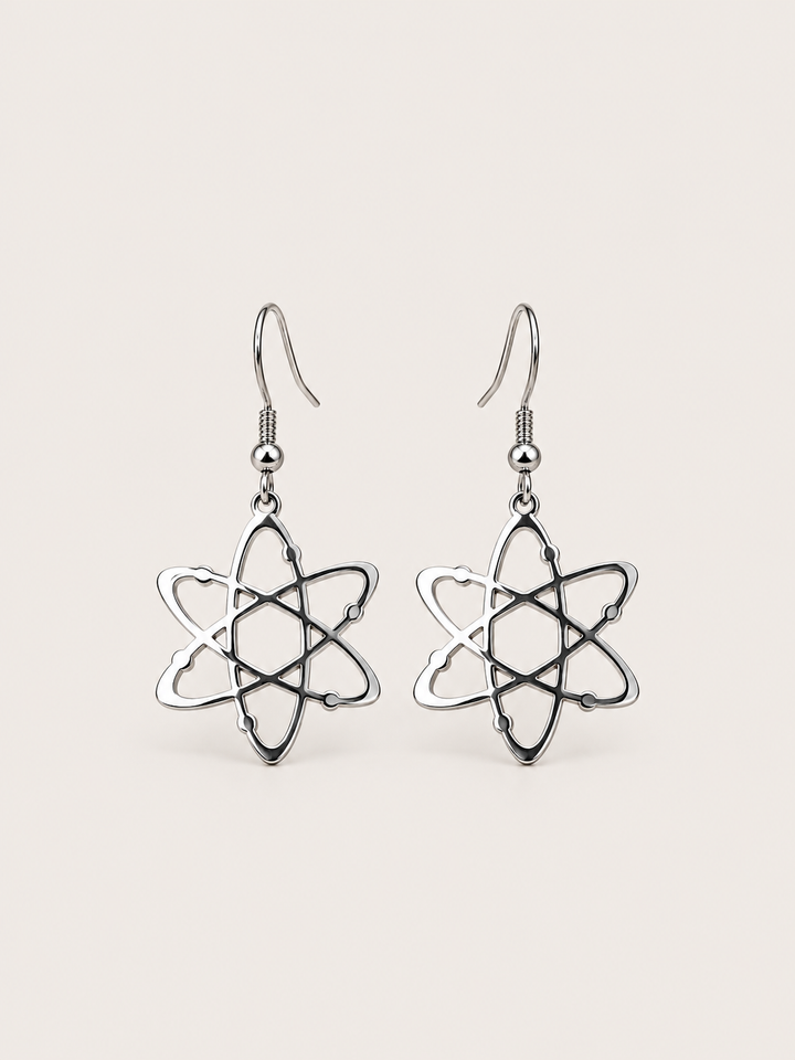 Silver Atom Drop Earrings shown on a warm neutral background
