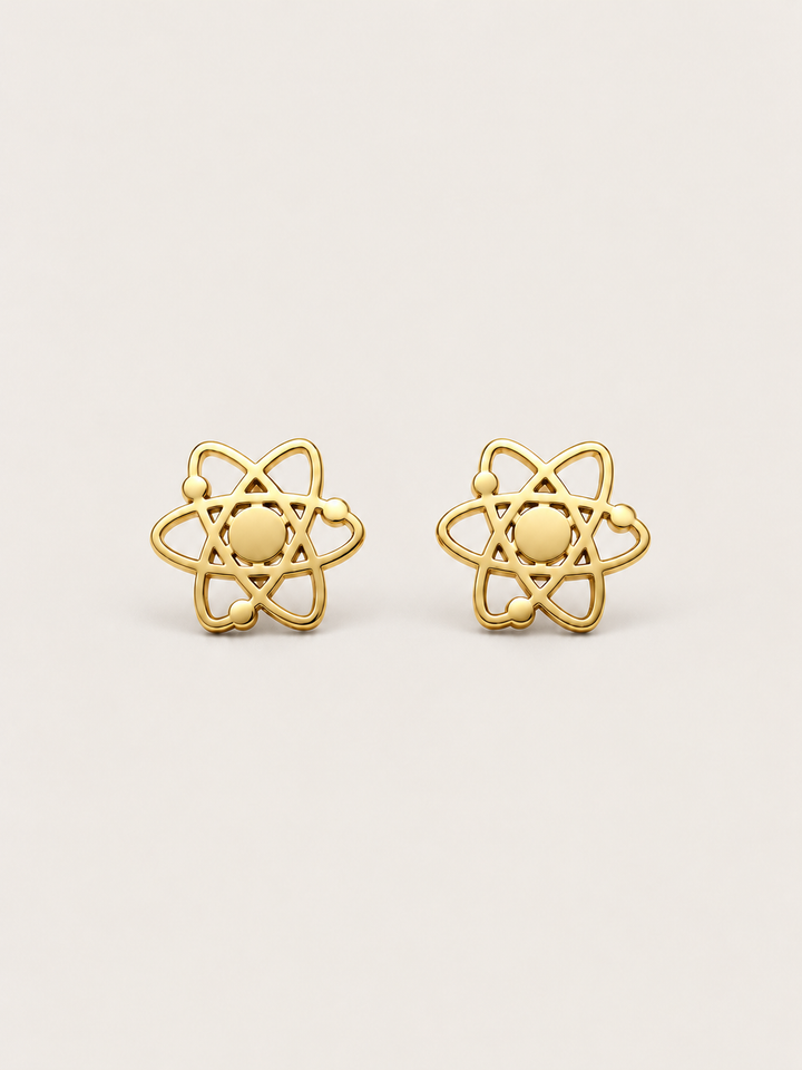 Atom Stud Earrings in gold shown straight on on a warm neutral background