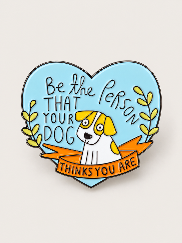 Be the Person Your Dog Thinks You Are Pin shown on a warm neutral background