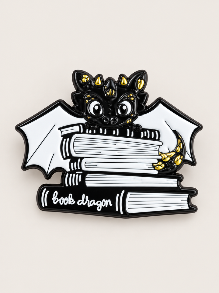 Black Book Dragon Pin shown on a warm neutral background