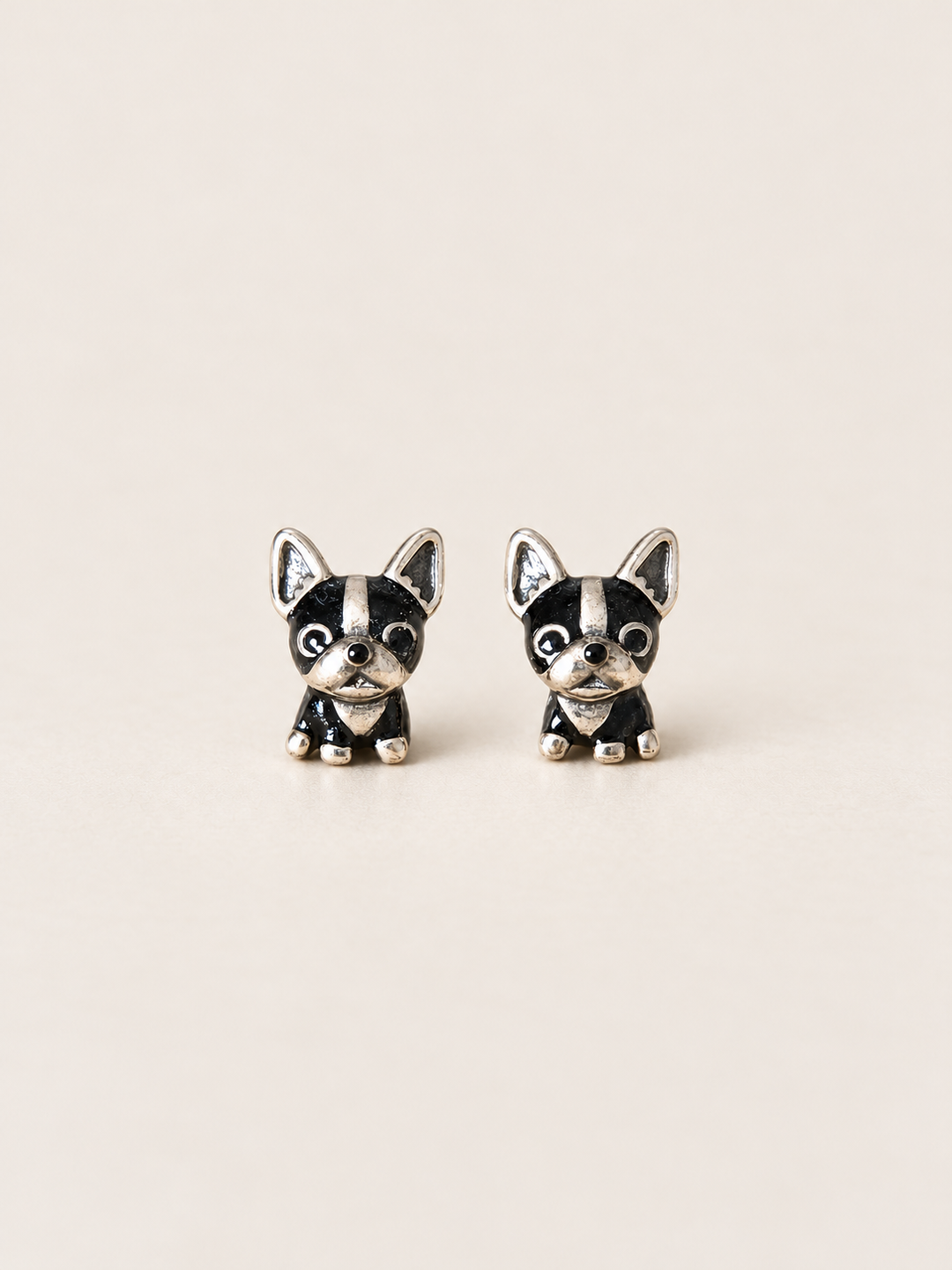 Black Dog Stud Earrings shown on a warm neutral background