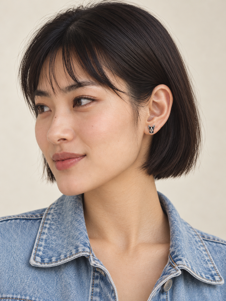 Black Dog Stud Earrings worn on a model