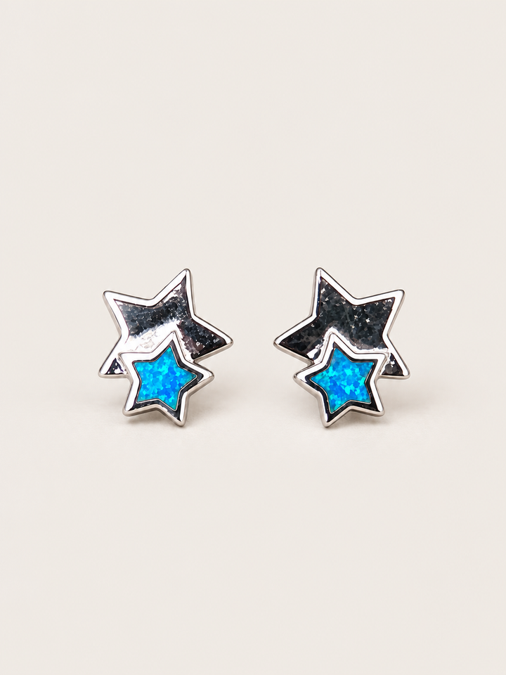 Blue Double Star Stud Earrings shown on a warm neutral background