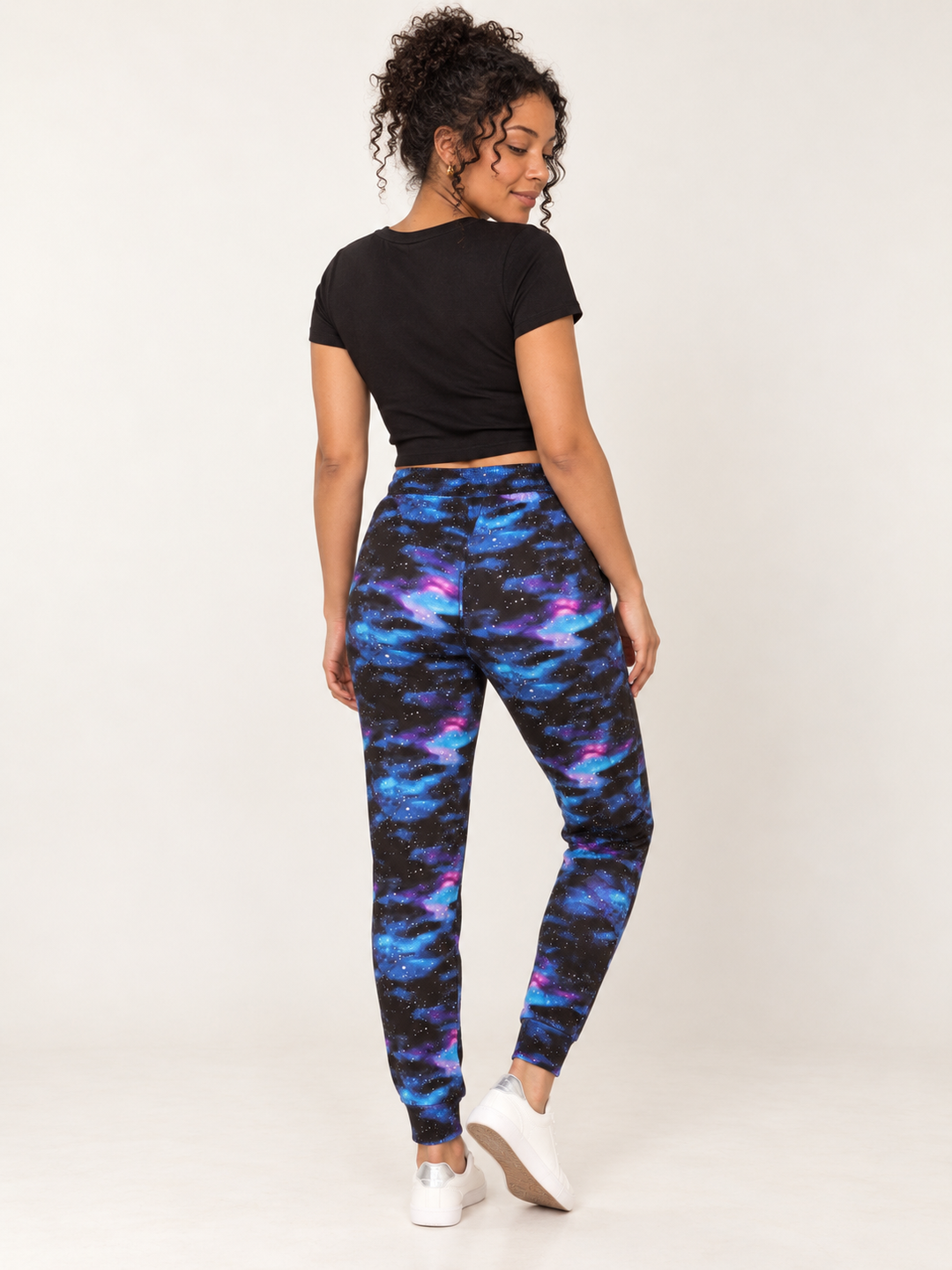 Model wearing Blue Galaxy Joggers, full-body back view