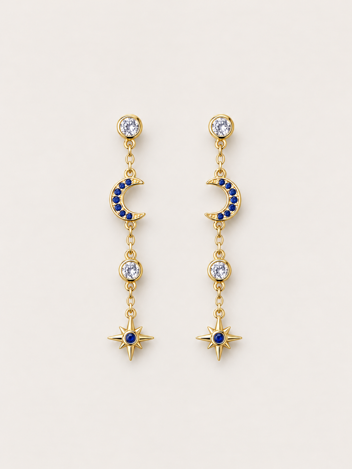 Blue Moon and Star Drop Earrings shown on a warm neutral background