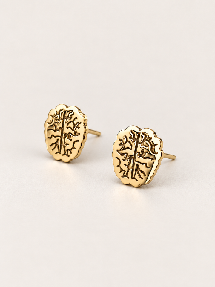 Gold Brain Stud Earrings shown angled on a warm neutral background