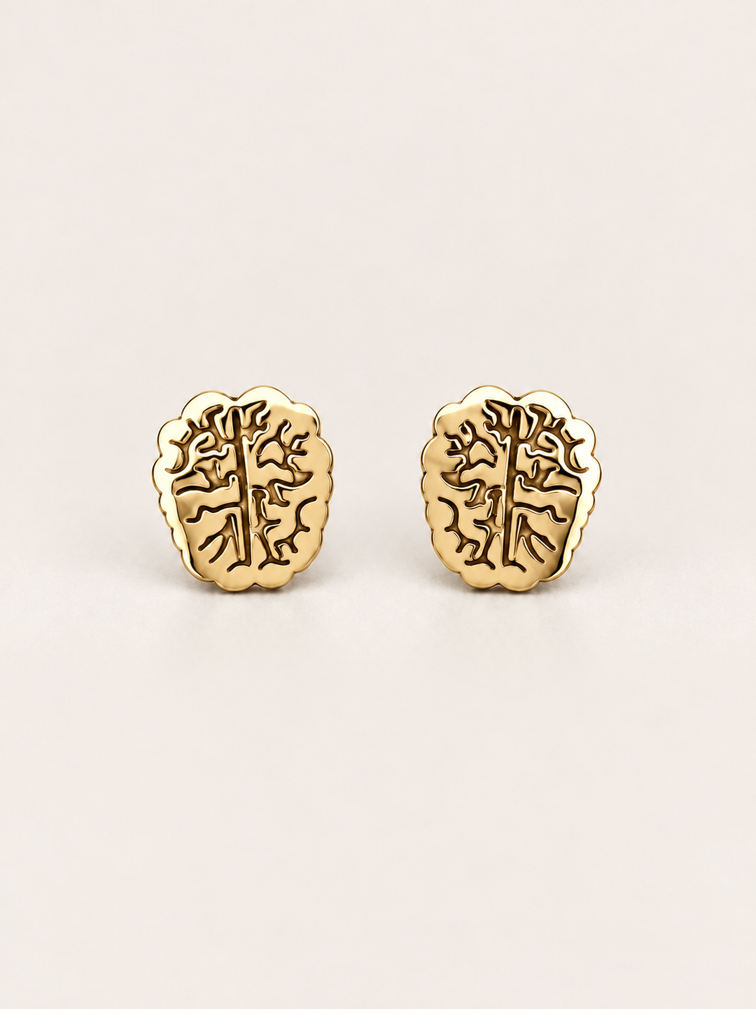 Gold Brain Stud Earrings shown on a warm neutral background