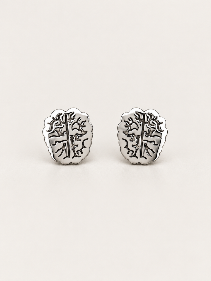 Silver Brain Stud Earrings shown on a warm neutral background