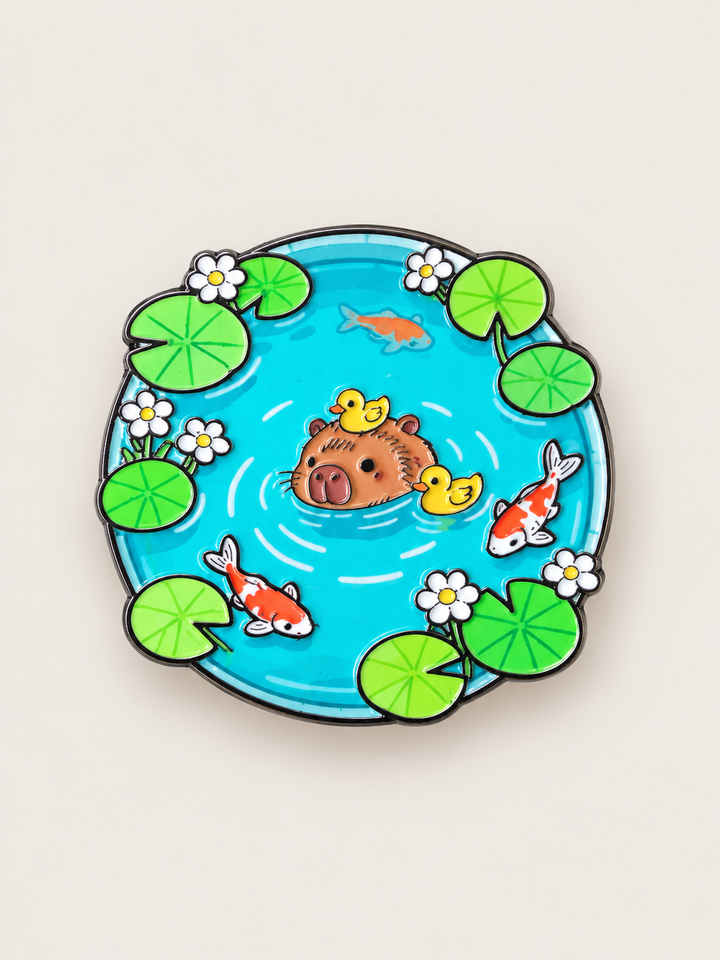 Capybara Koi Pond Pin shown on a warm neutral background
