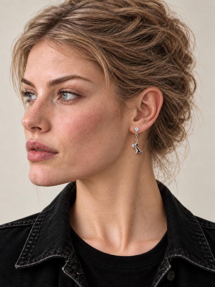 Silver Cat Crystal Drop Earrings worn on viewer-right ear, cat with raised crystal
