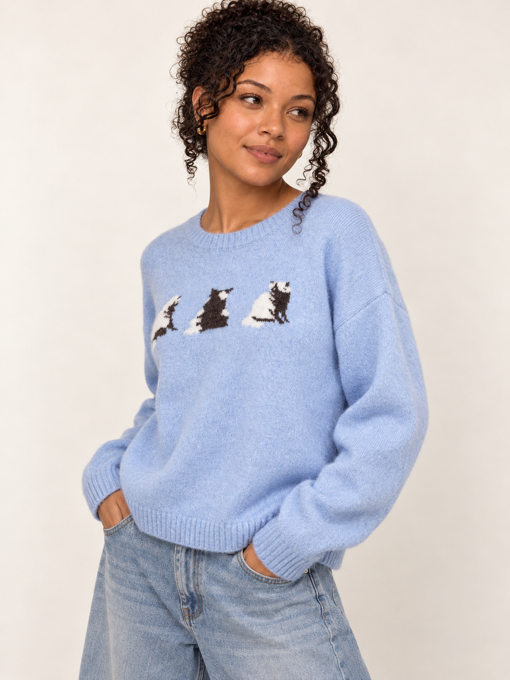 Model wearing Cat Sweater Blue, angled view