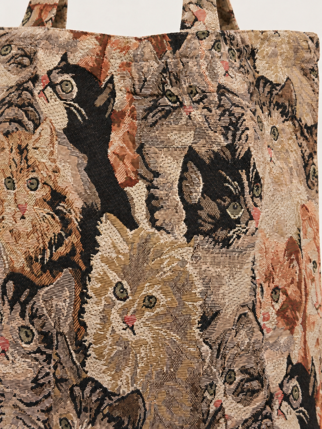 Close-up of cat tapestry tote bag pattern and woven texture