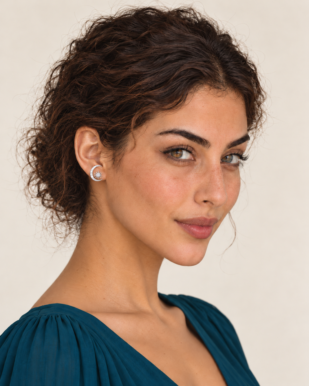 Model wearing the silver crescent earring on her left ear