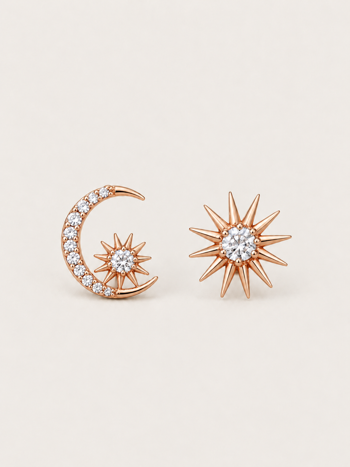 Rose gold Celestial Moon and Starburst Earrings shown on a warm neutral background