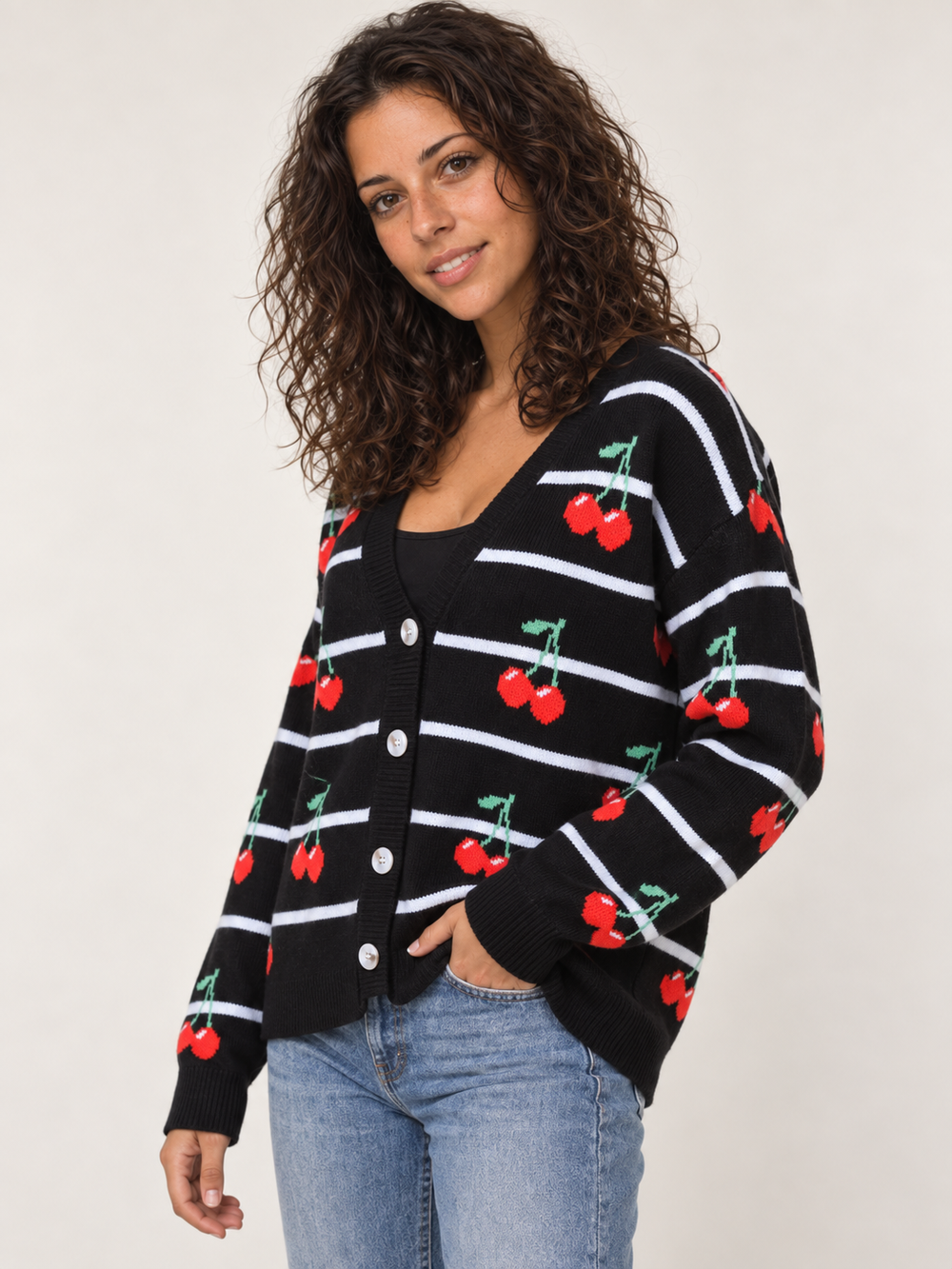 Model wearing Cherry Stripe Cardigan, angled view