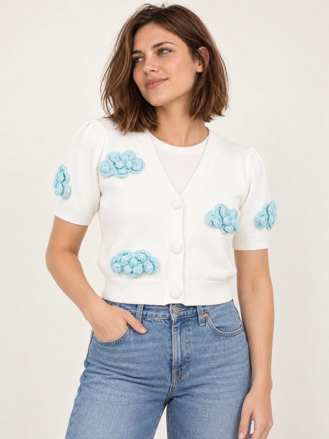 Model wearing Cloud Short Sleeve Cardigan Ivory — front view