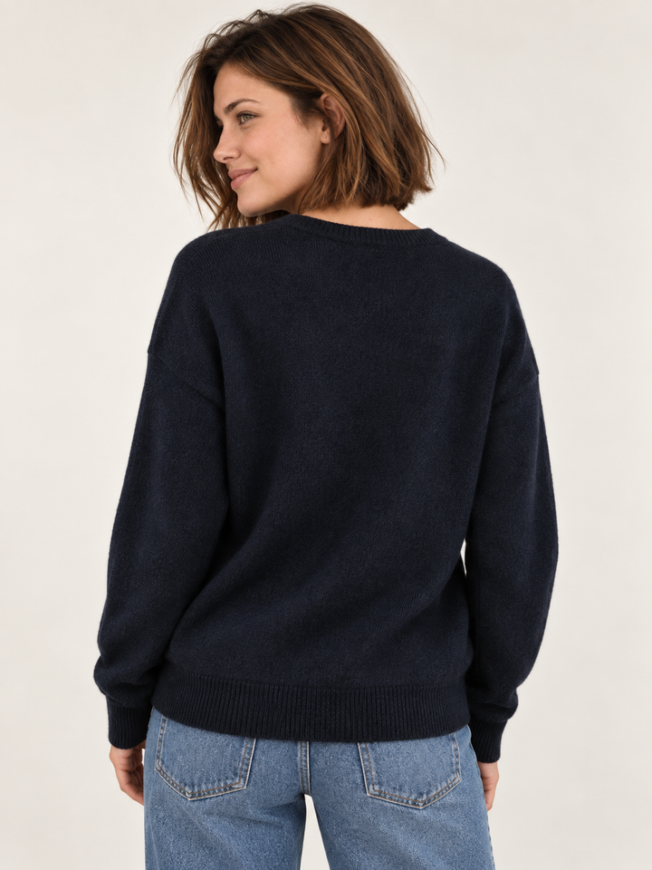 Model wearing Corgi Bandana Sweater in navy, back view