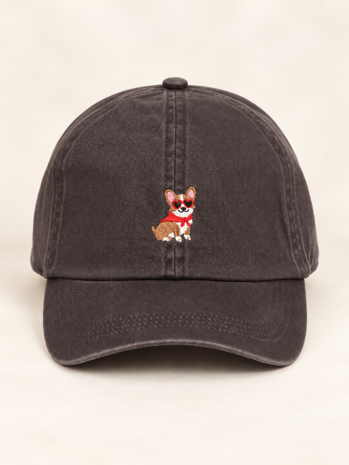 Front view of charcoal cap with corgi wearing red heart sunglasses and bandana