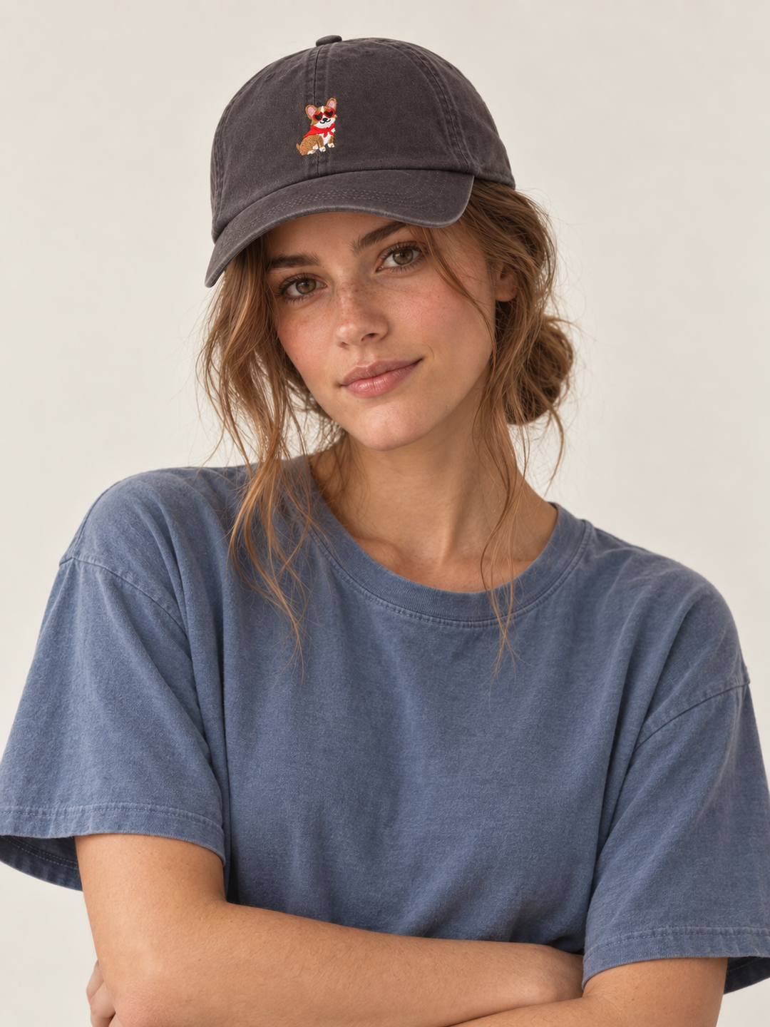 Model wearing the charcoal corgi embroidered baseball cap