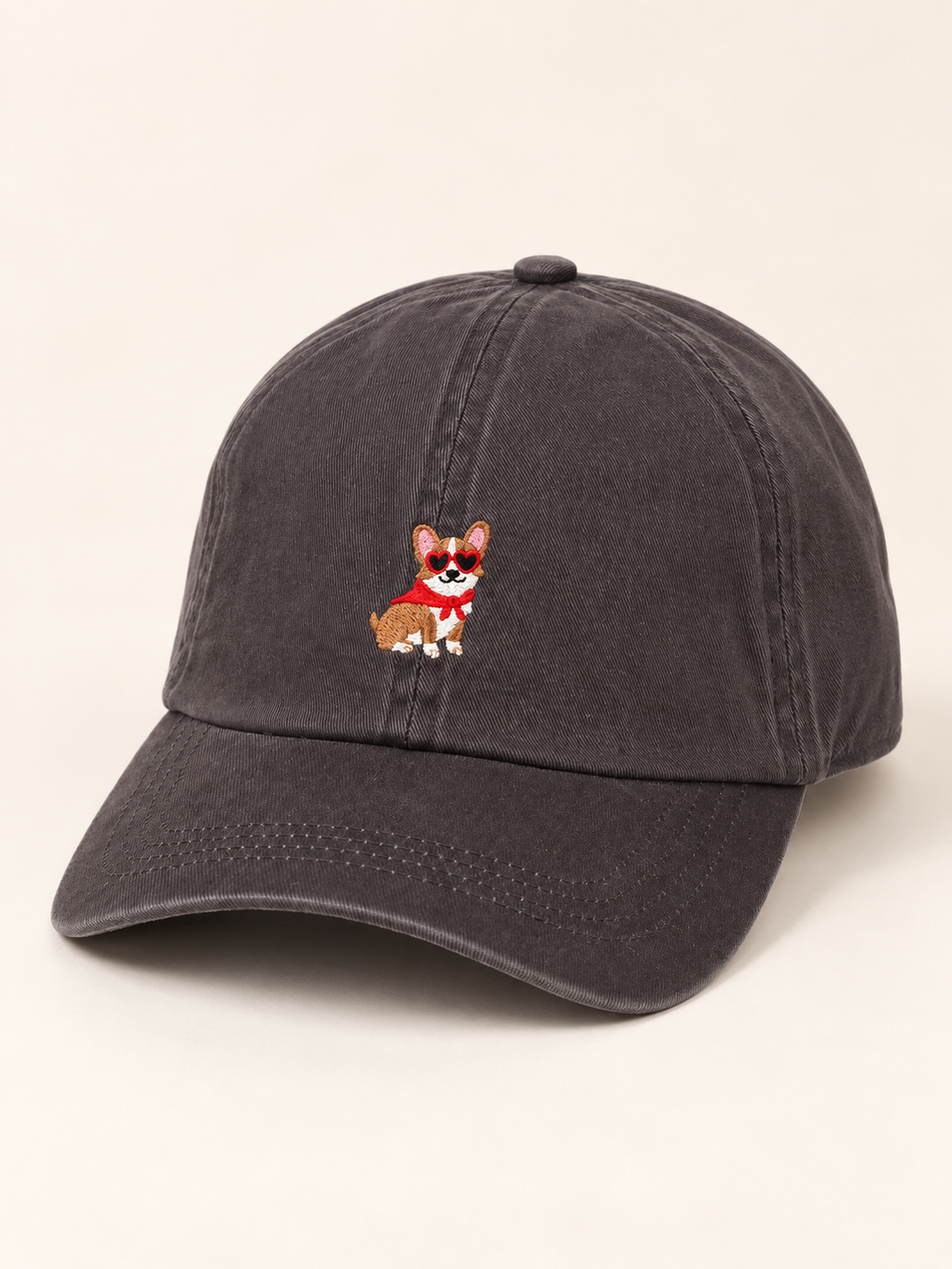 Three-quarter view of charcoal corgi embroidered baseball cap