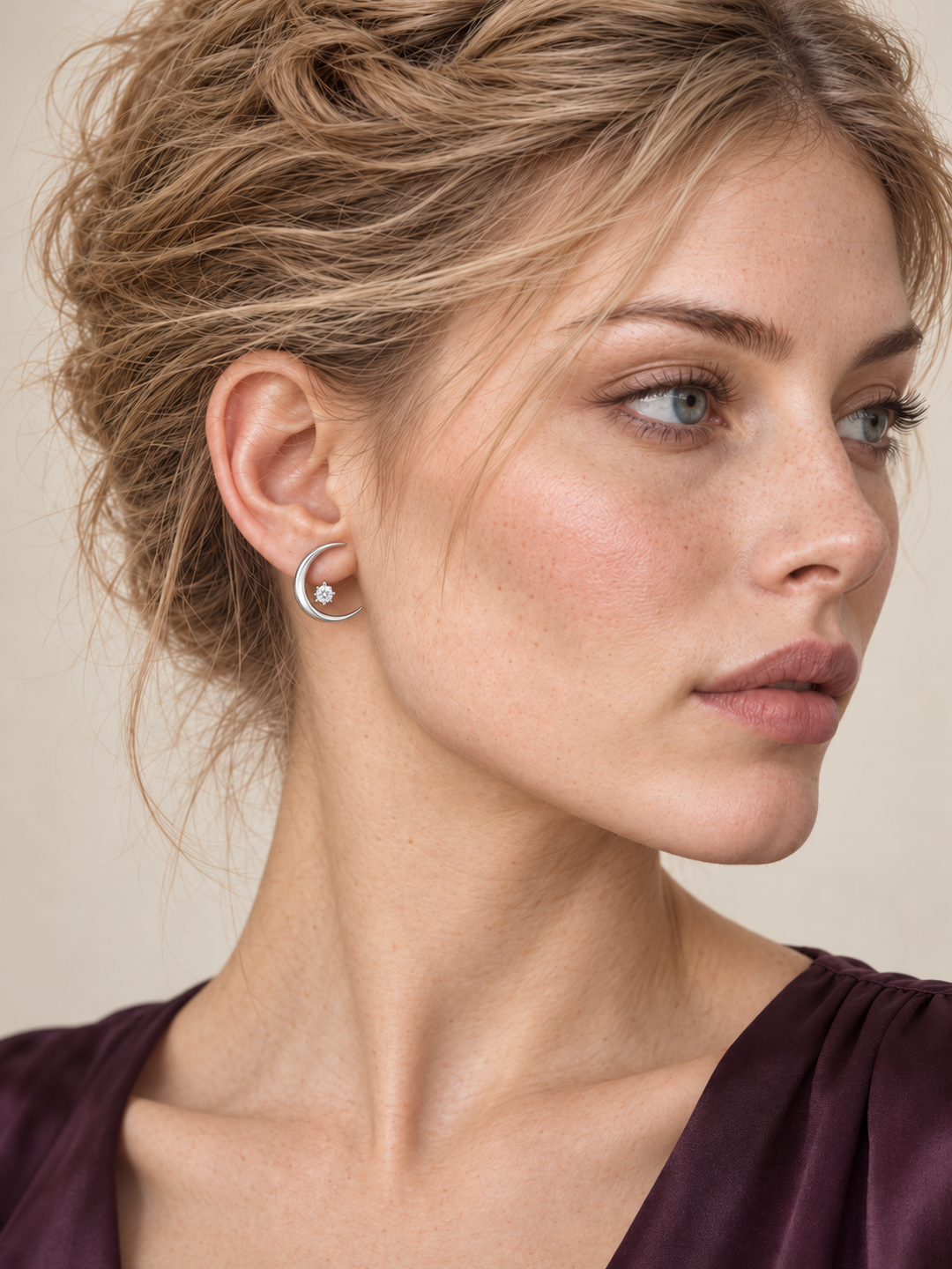 Crescent Moon Ear Jacket Earrings in Silver worn with the stone below the earlobe