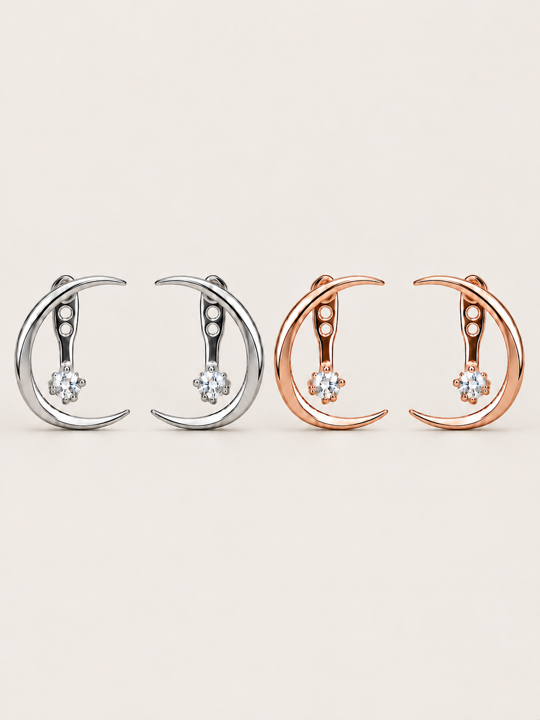Crescent Moon Ear Jacket Earrings in Silver and Rose Gold shown on a warm neutral background