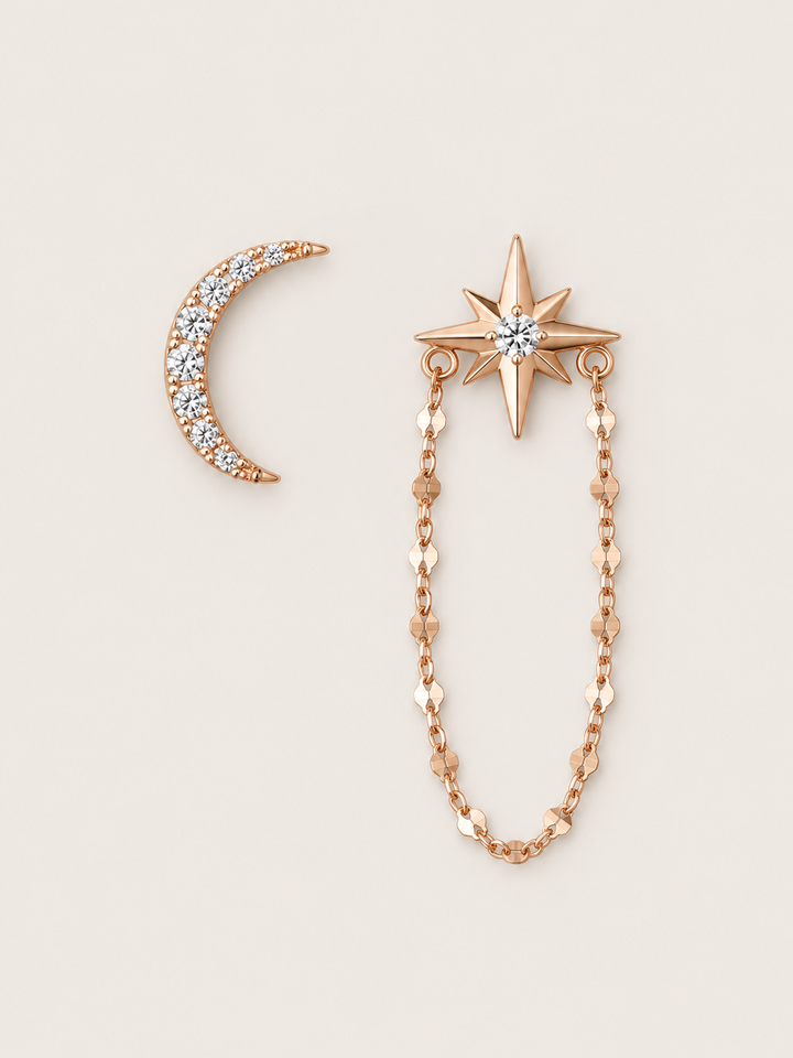 Crescent Moon and Star Chain Earrings shown on a warm neutral background