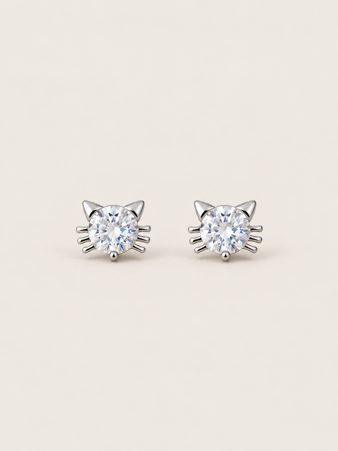 Crystal Cat Stud Earrings shown on a warm neutral background