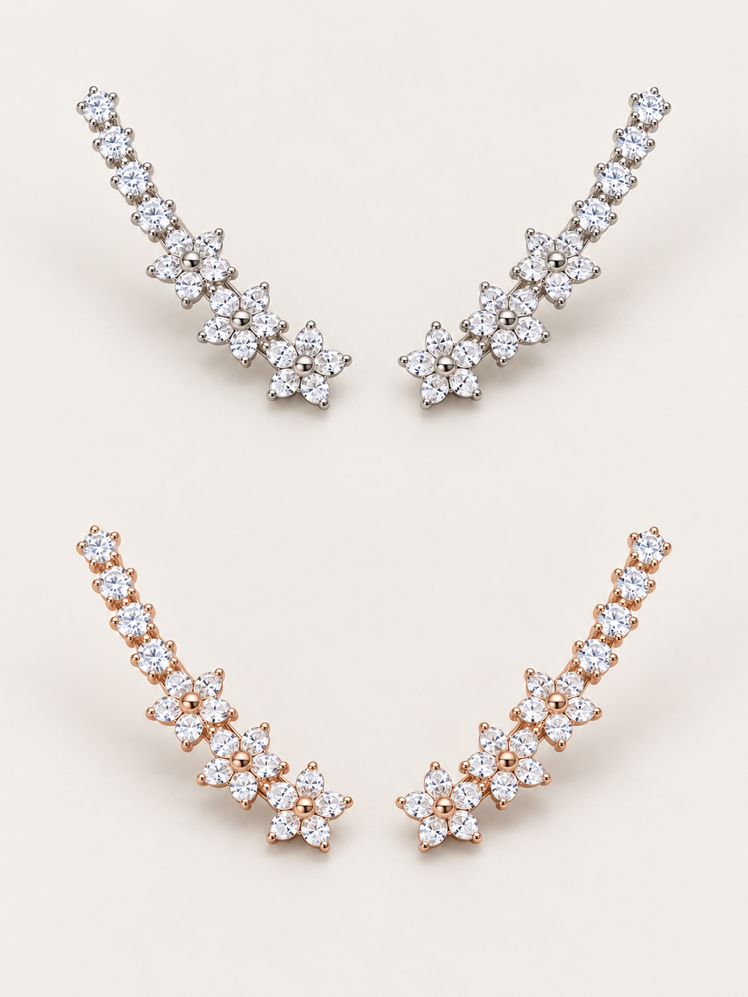 Crystal Flower Ear Crawler Earrings in silver above rose gold on a warm neutral background
