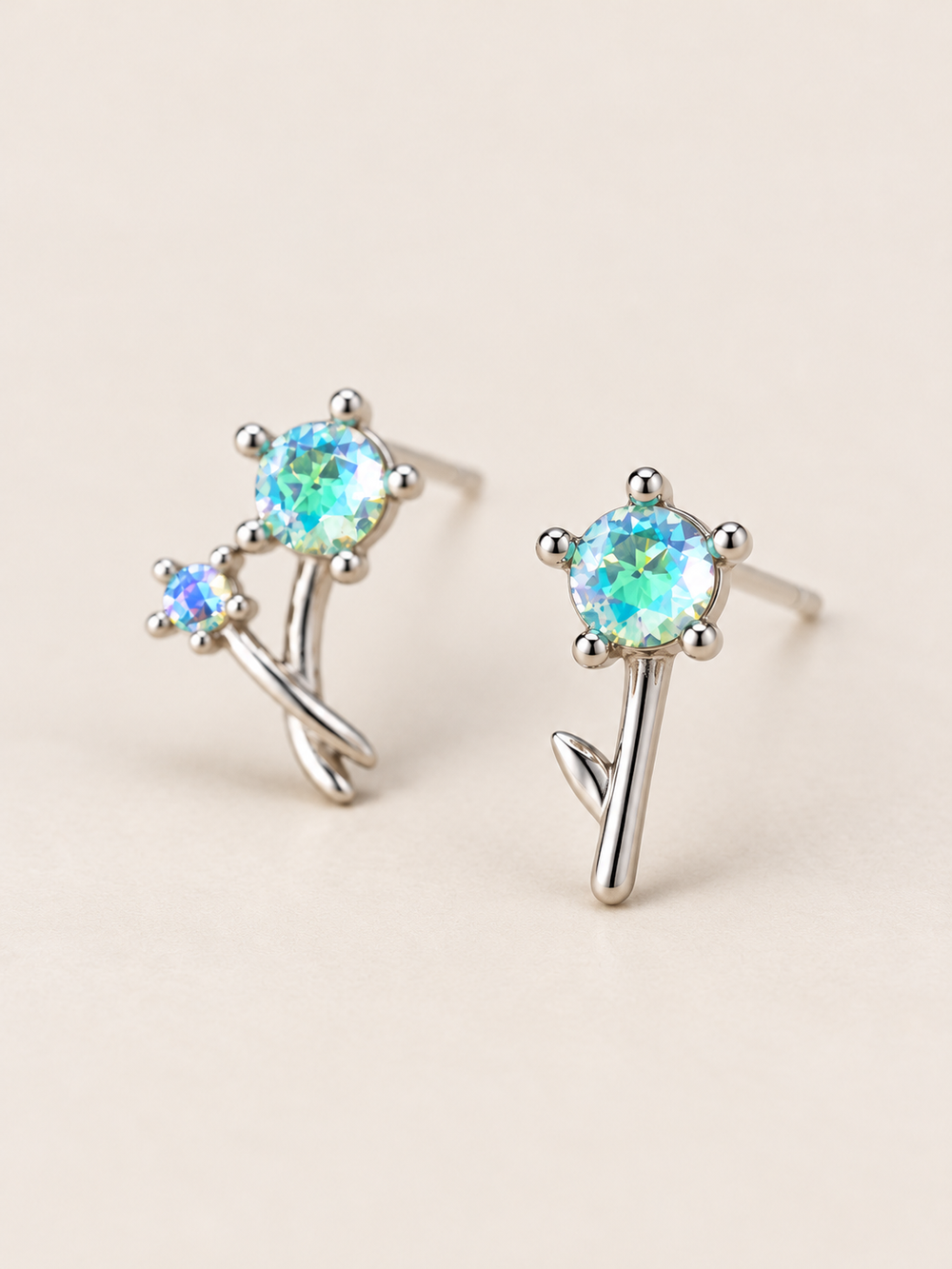 Crystal Flower Earrings shown angled on a warm neutral background