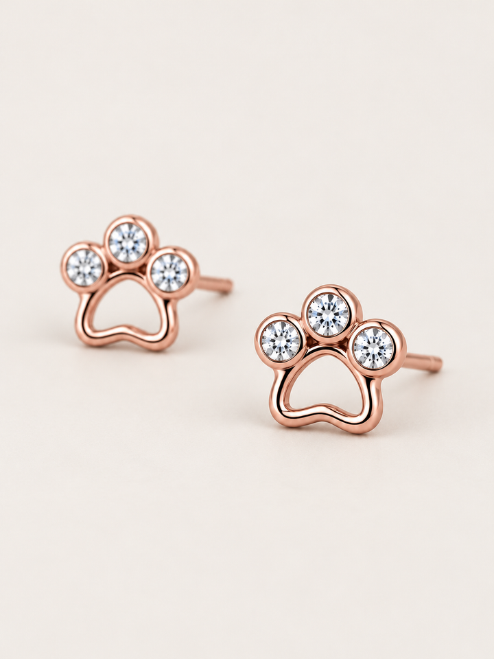 Crystal Paw Print Stud Earrings — Rose Gold angled view