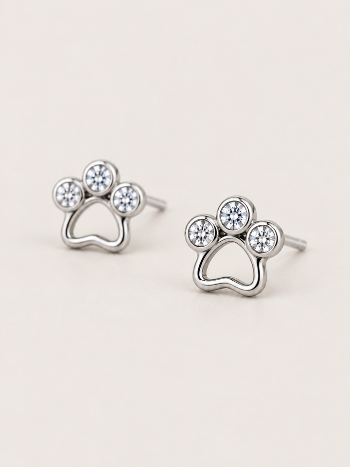 Crystal Paw Print Stud Earrings — Silver angled view