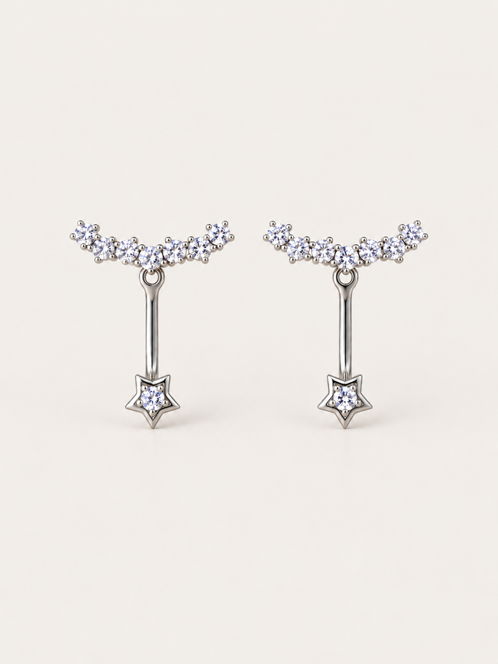 Crystal Star Ear Jacket Earrings shown on a warm neutral background