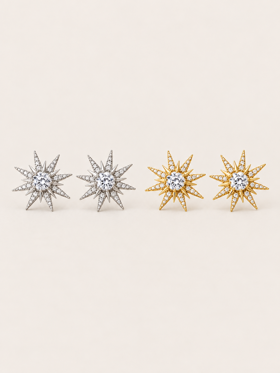 Crystal Starburst Stud Earrings in Silver and Gold shown on a warm neutral background