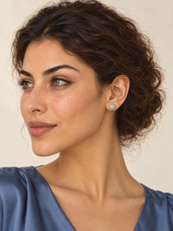 Crystal Starburst Stud Earrings in Silver worn on the viewer-right ear