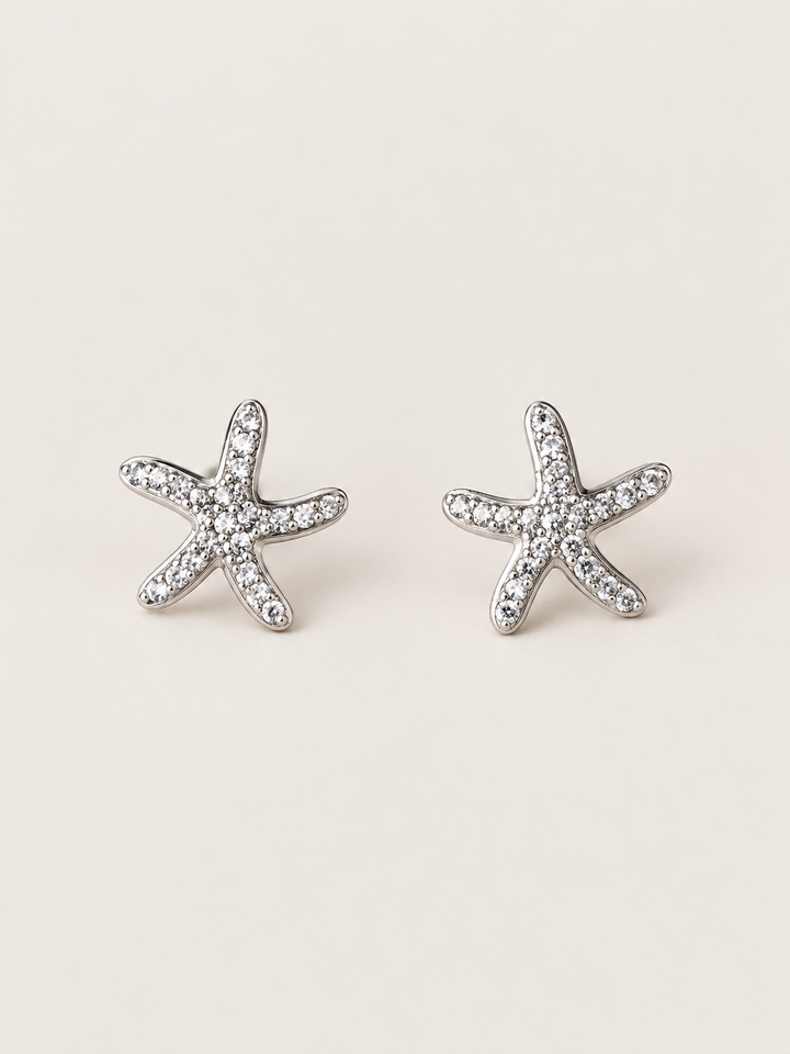 Silver Crystal Starfish Stud Earrings shown on a warm neutral background