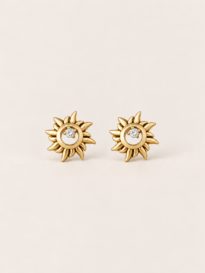 Gold Crystal Sun Stud Earrings shown on a warm neutral background