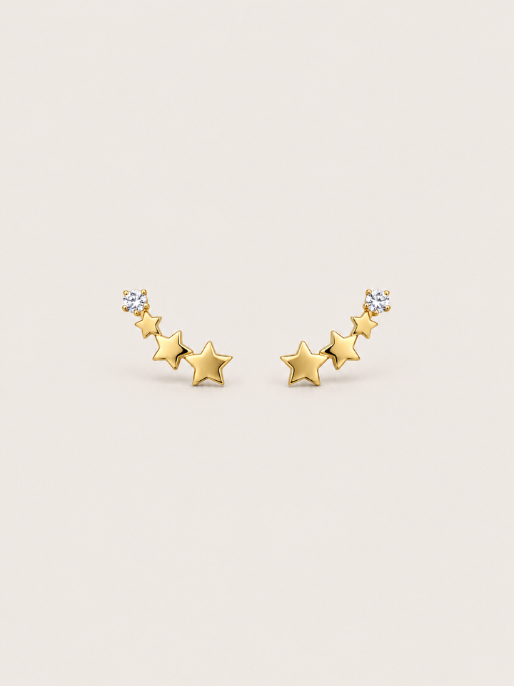 Crystal and Three Star Earrings shown on a warm neutral background