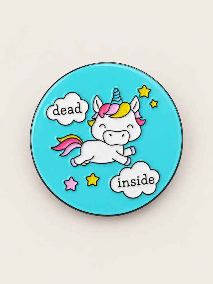 Dead Inside Unicorn Pin shown on a warm neutral background