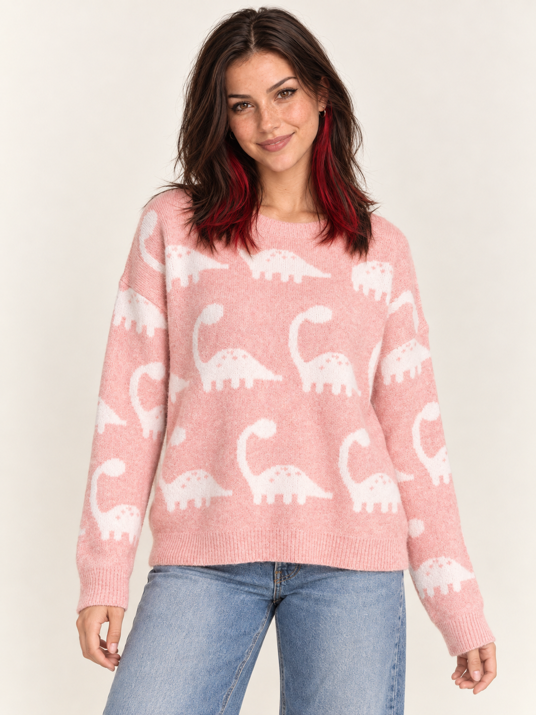 Model wearing pink brontosaurus sweater, front view