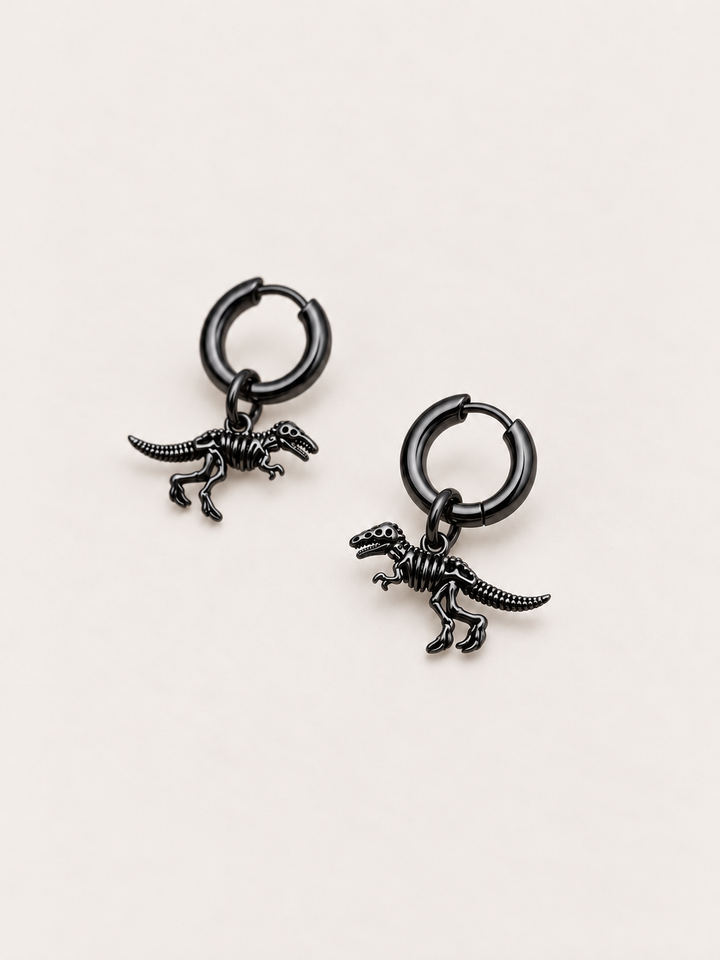 Dinosaur Skeleton Hoop Earrings — black angle on a warm neutral background