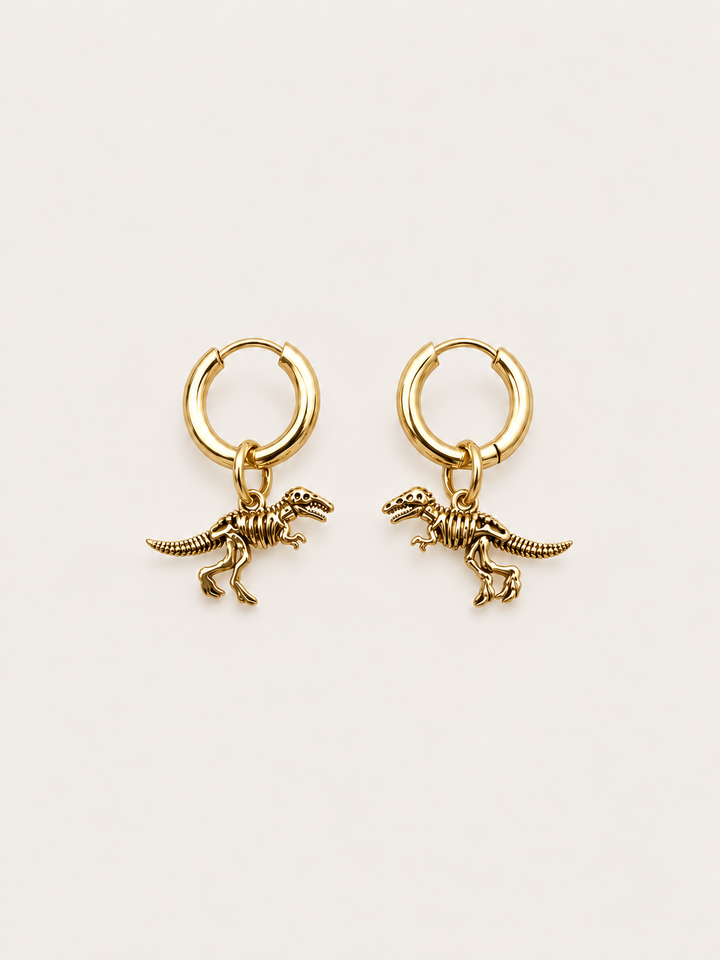 Dinosaur Skeleton Hoop Earrings — gold main on a warm neutral background