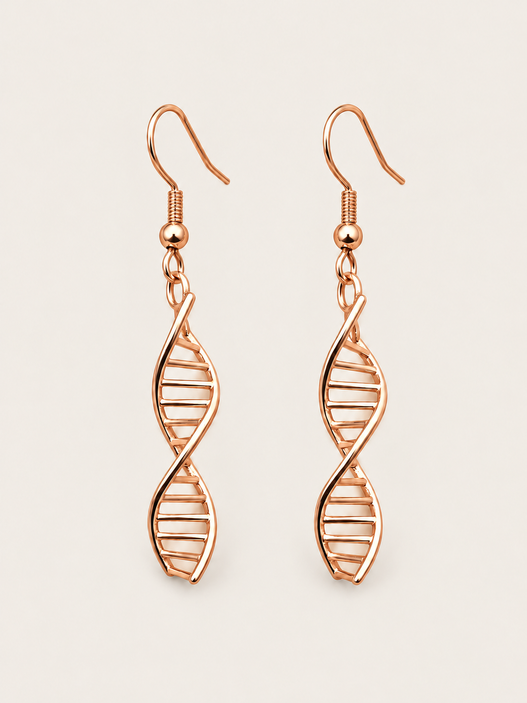 Rose Gold DNA Double Helix Earrings shown on a warm neutral background
