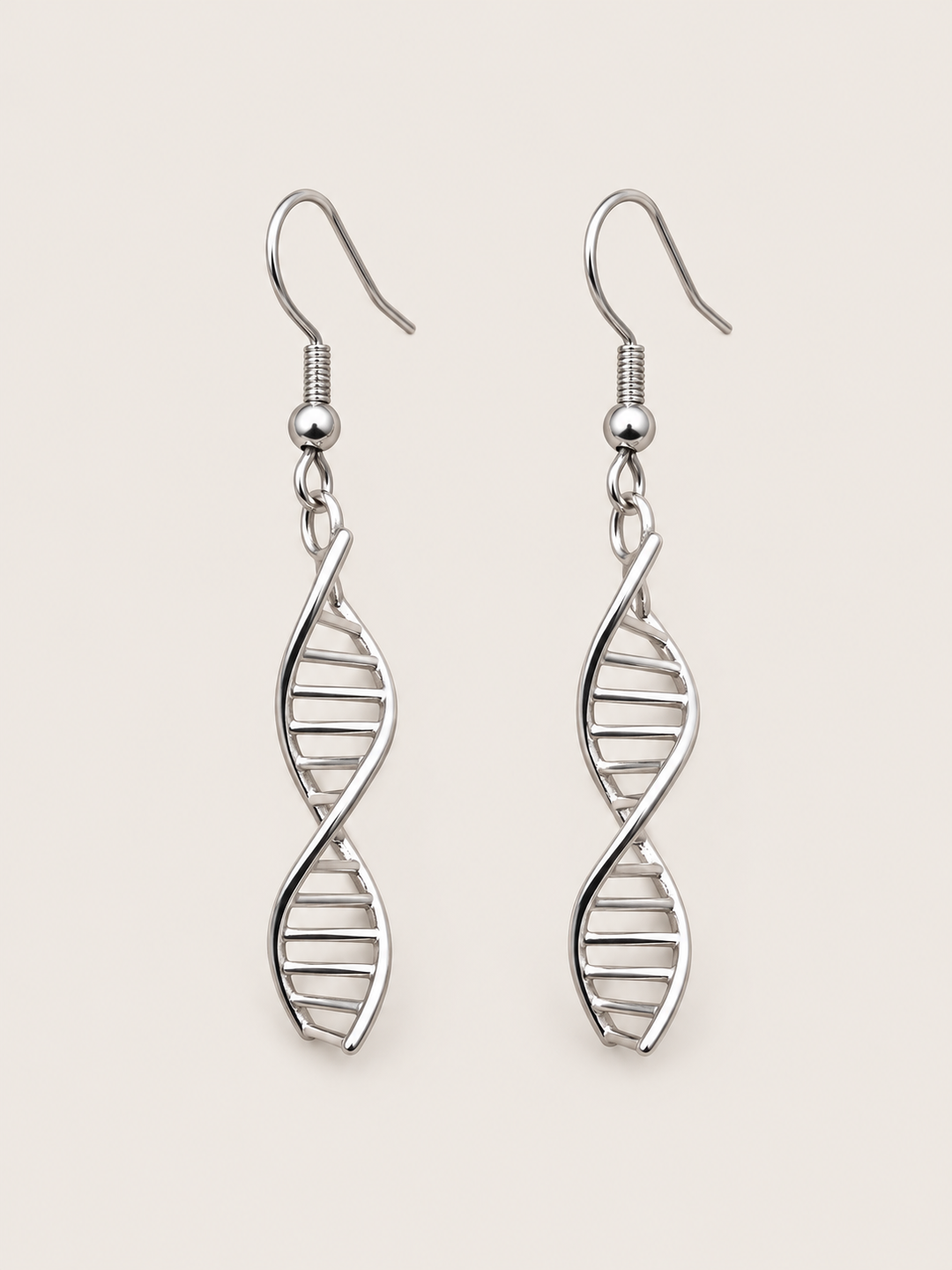 Silver DNA Double Helix Earrings shown on a warm neutral background