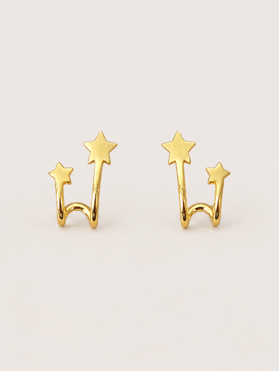 Double Star Wrap Earrings shown on a warm neutral background