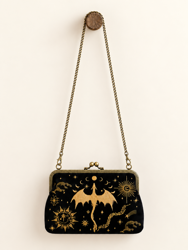 Dragon Kisslock Bag hanging from its detachable flat chain strap