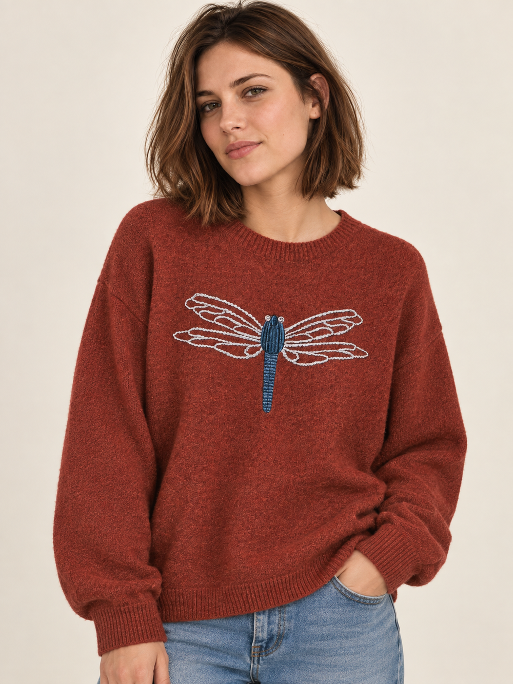 Model wearing Dragonfly Embroidered Sweater Rust — front view